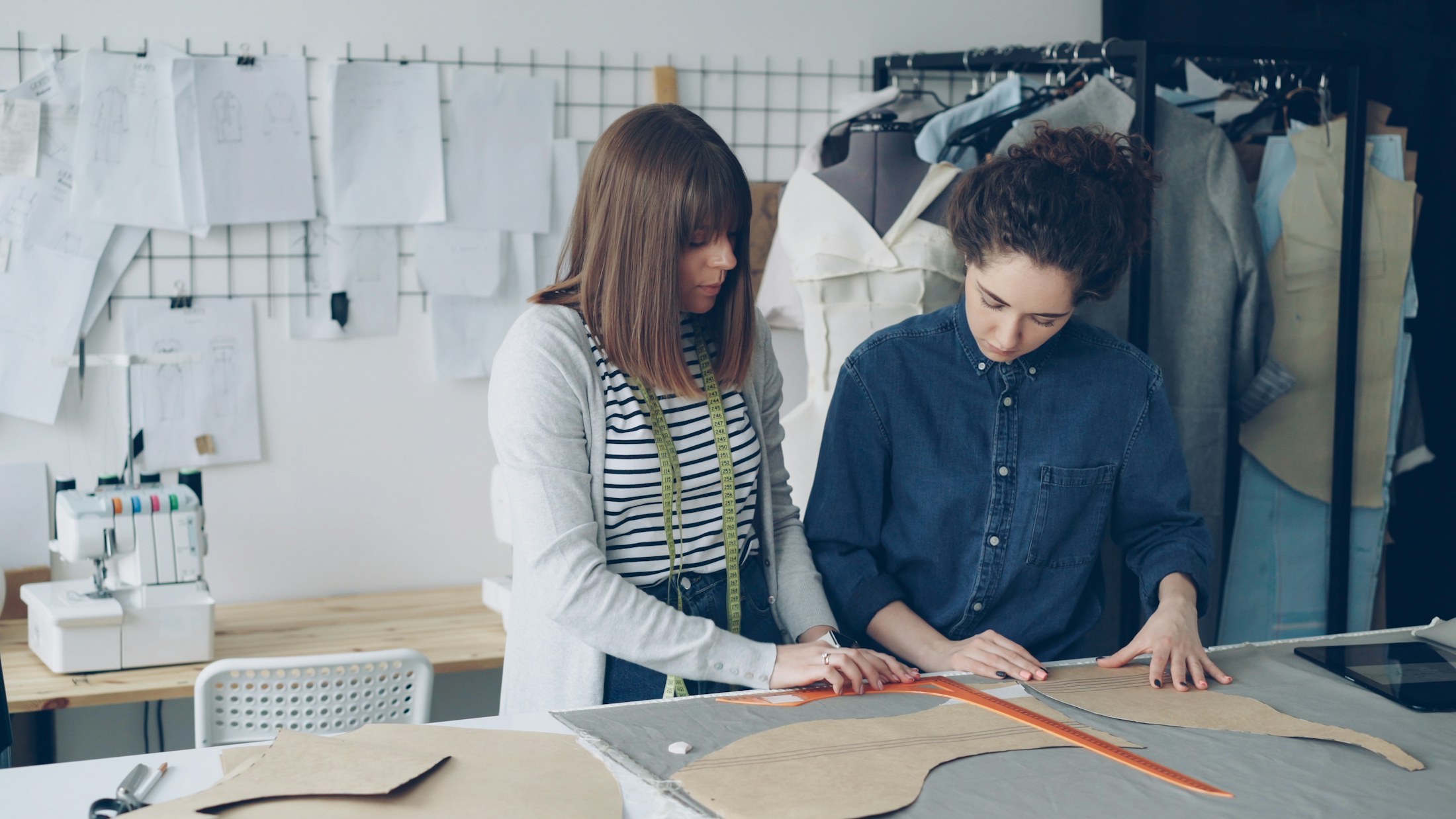 Apparel pattern and sample development team reviewing a garment in China