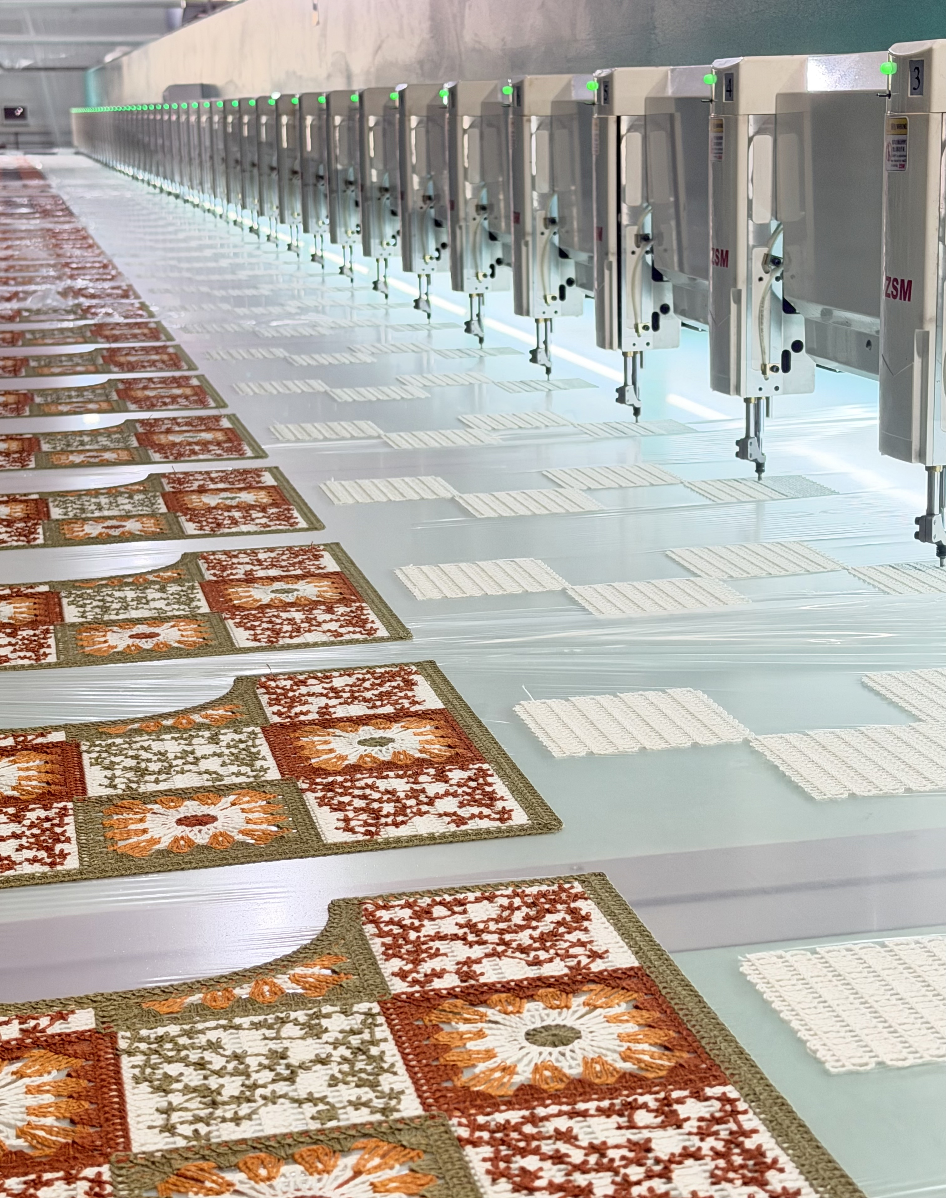 Water-soluble embroidery machines producing connected crochet-look garment panels in China