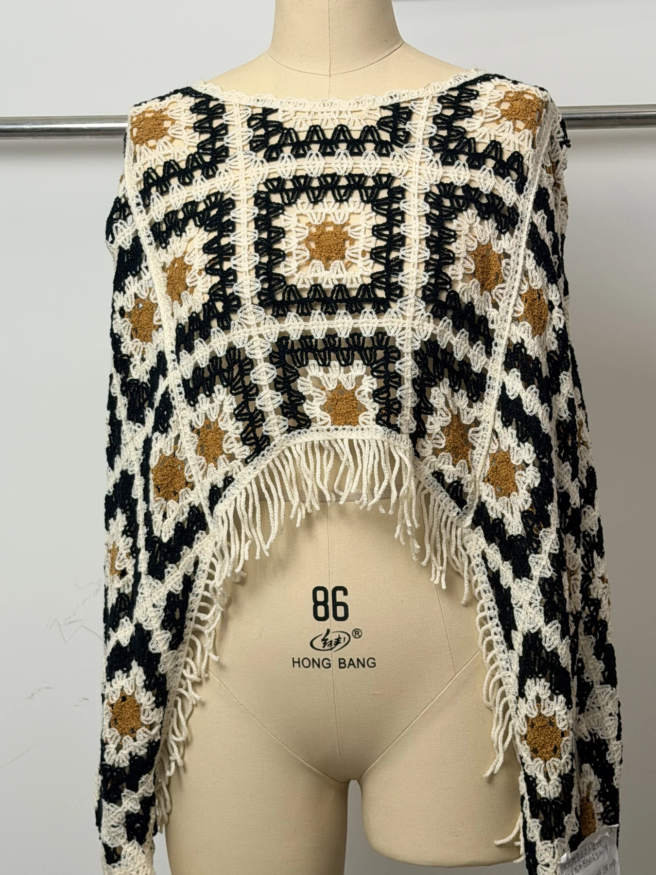Wholesale Black Ivory Geometric Fringe Crochet-Look Poncho for OEM and private label production