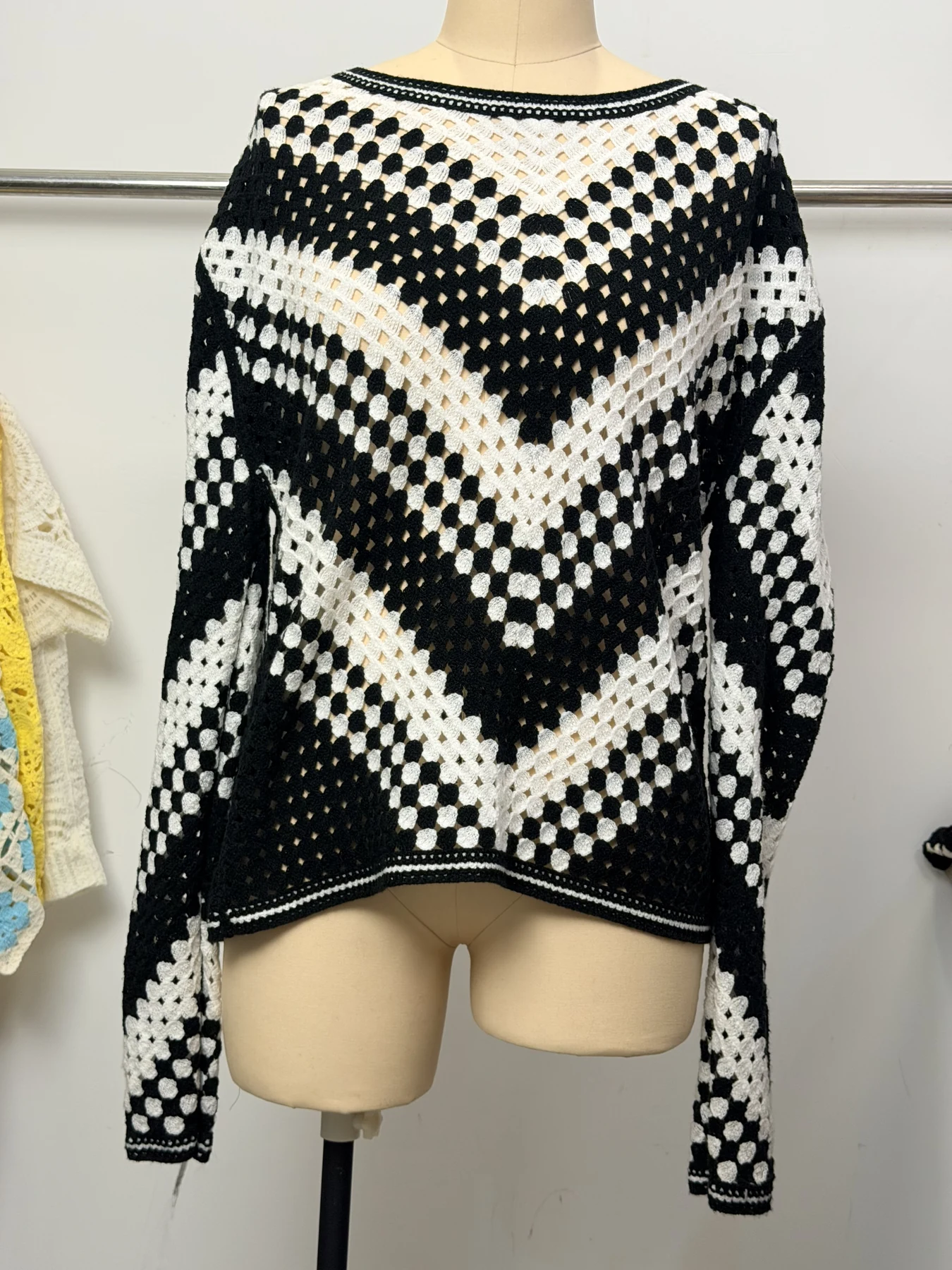 Wholesale Black Ivory Chevron Crochet-Look Poncho Sweater for OEM and private label production