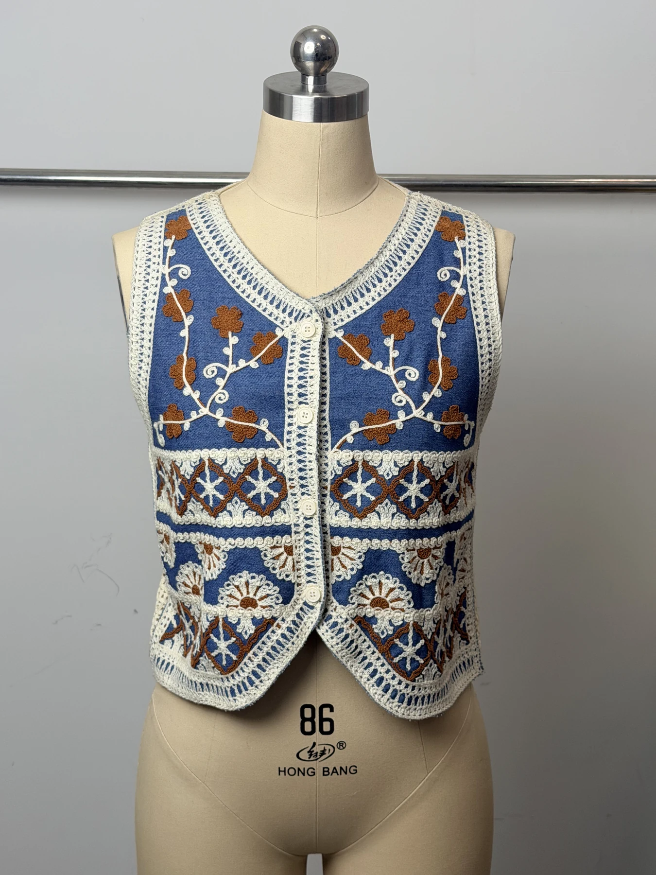 Wholesale Blue Rust Floral Crochet-Look Button Vest for OEM and private label production